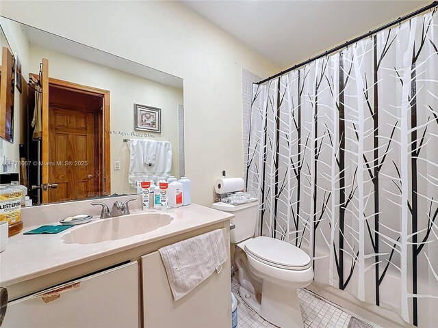 full bathroom with shower / bathtub combination with curtain, vanity, toilet, and tile patterned flooring