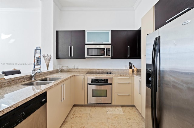 kitchen featuring light stone countertops, sink, stainless steel appliances, crown molding, and cream cabinetry