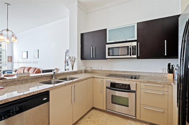 kitchen with sink, light stone countertops, stainless steel appliances, and a chandelier