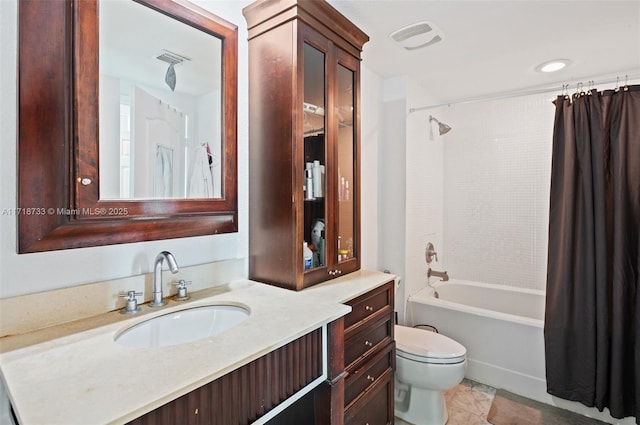 full bathroom featuring tile patterned flooring, shower / tub combo with curtain, vanity, and toilet