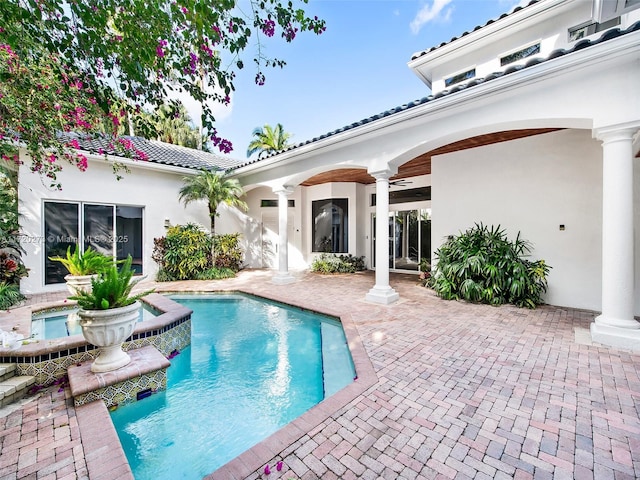 view of swimming pool with ceiling fan