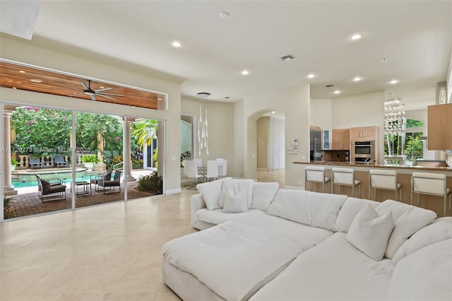 living room featuring ceiling fan