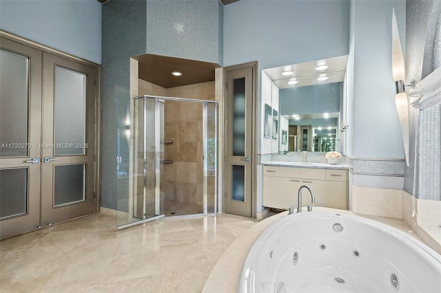 bathroom featuring vanity, plus walk in shower, and a high ceiling