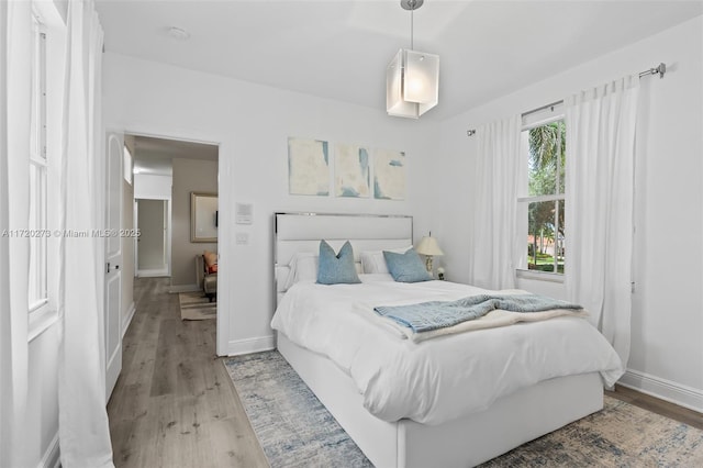 bedroom with light hardwood / wood-style flooring