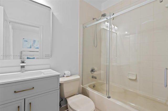 full bathroom featuring vanity, toilet, and enclosed tub / shower combo