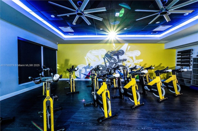 exercise room with ceiling fan