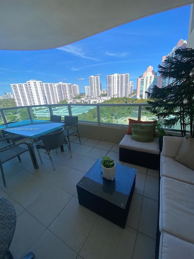 view of patio / terrace with an outdoor hangout area and a balcony