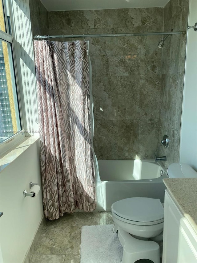 full bathroom with shower / bath combo, vanity, and toilet