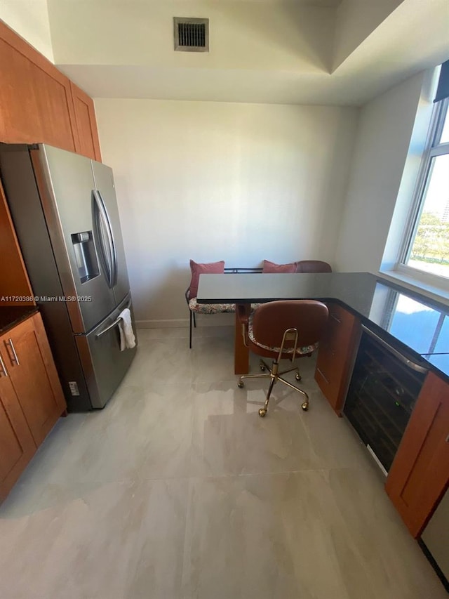 3340 NE 190th St Unit 1101, Aventura, FL 33180 - kitchen featuring stainless steel fridge and brown cabinetry