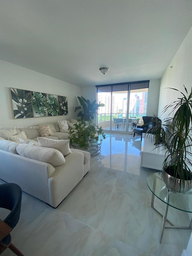 living room featuring a wall of windows