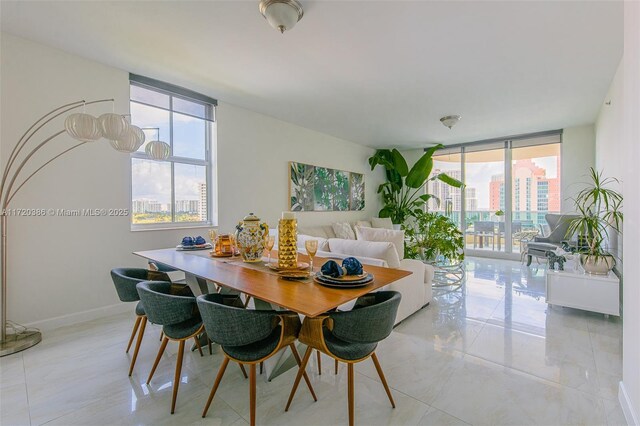 3340 NE 190th St Unit 1101, Aventura, FL 33180 - dining space featuring plenty of natural light, expansive windows, and light tile patterned flooring