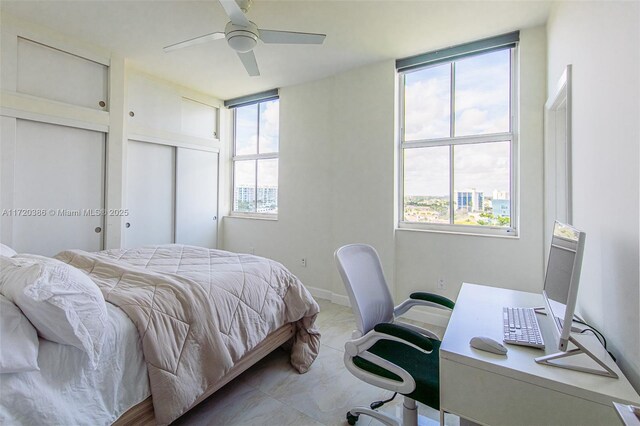 3340 NE 190th St Unit 1101, Aventura, FL 33180 - bedroom with an office area and a ceiling fan