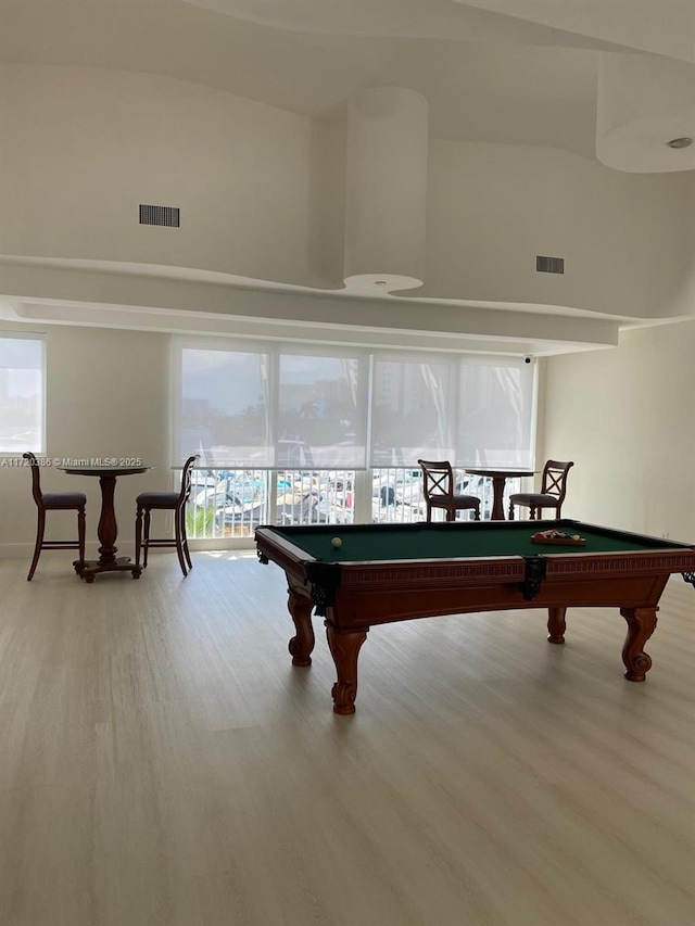 recreation room with light hardwood / wood-style floors and pool table