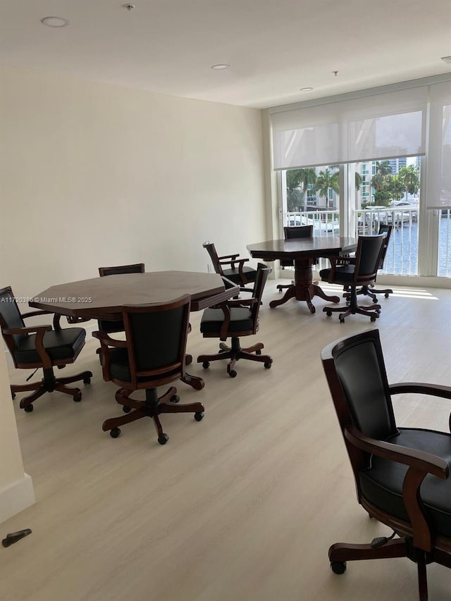 office area featuring light hardwood / wood-style flooring and floor to ceiling windows