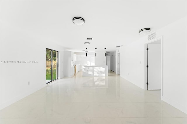 unfurnished room with light tile patterned floors