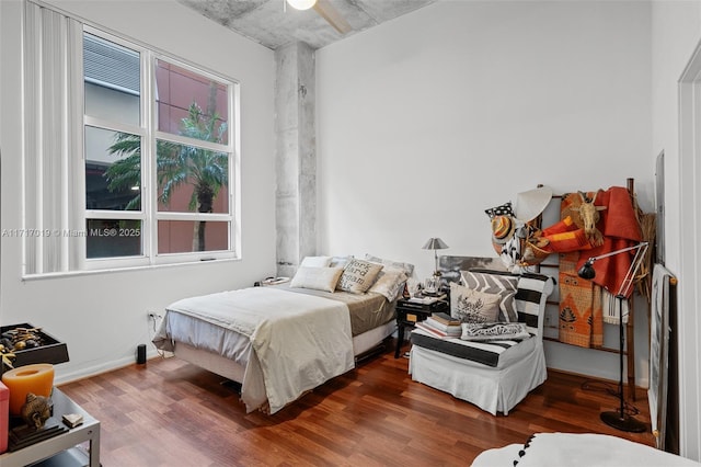 bedroom with ceiling fan and hardwood / wood-style floors