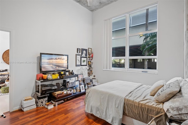 bedroom with wood-type flooring