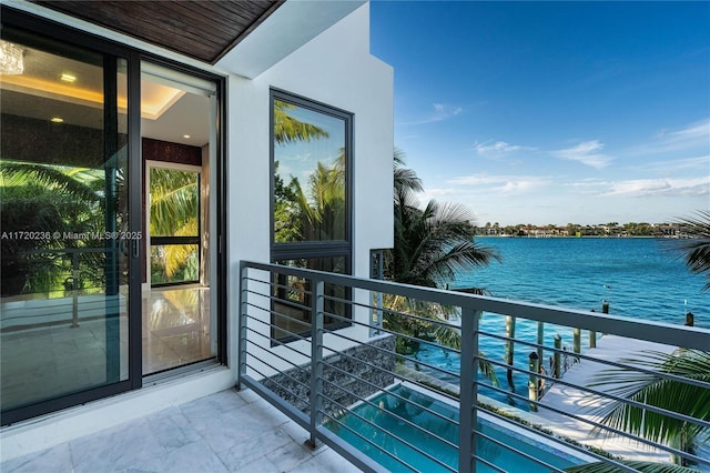 balcony featuring a water view