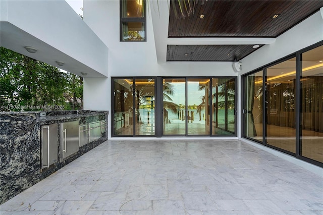 interior space with an outdoor kitchen