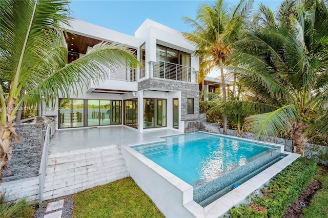 view of pool featuring a patio