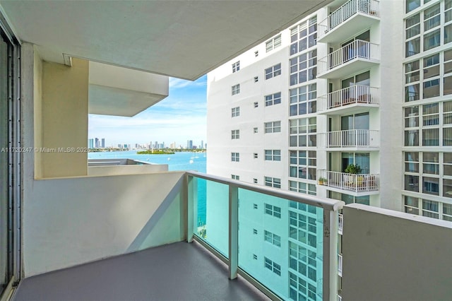 balcony featuring a water view