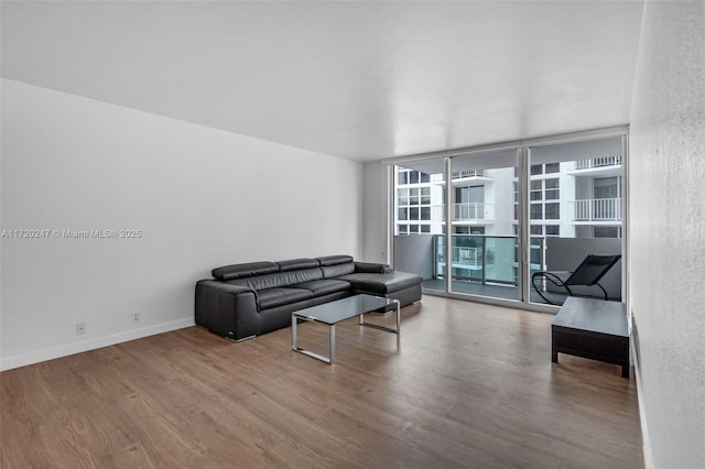 living room with hardwood / wood-style flooring and expansive windows