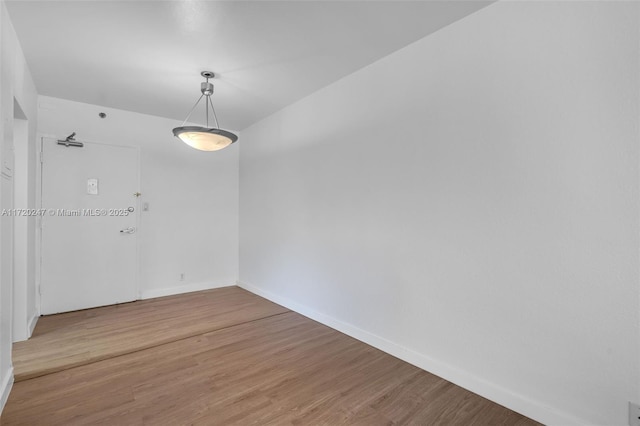 spare room featuring hardwood / wood-style floors