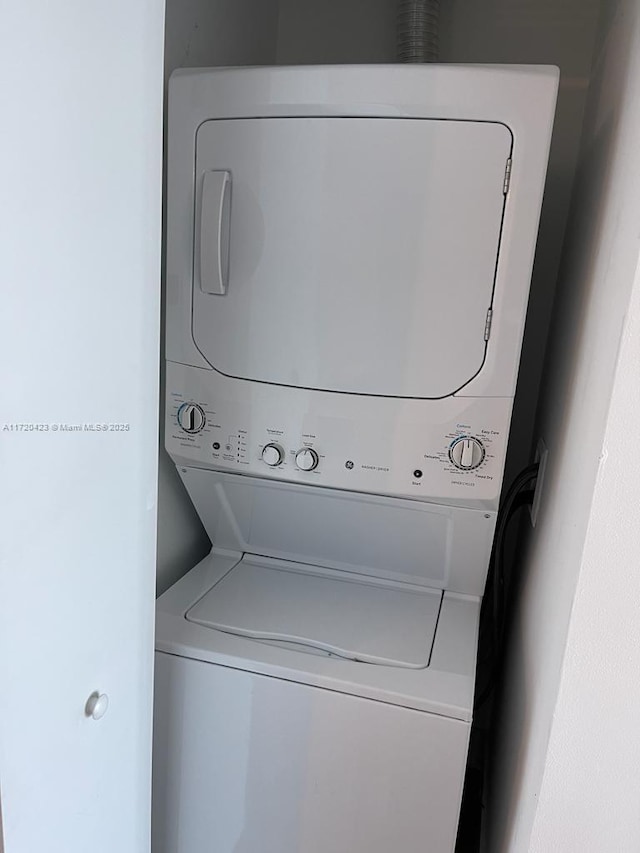 650 NE 32nd St Unit 1805, Miami, FL 33137 - laundry area featuring stacked washer / dryer