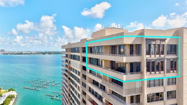 view of building exterior with a water view