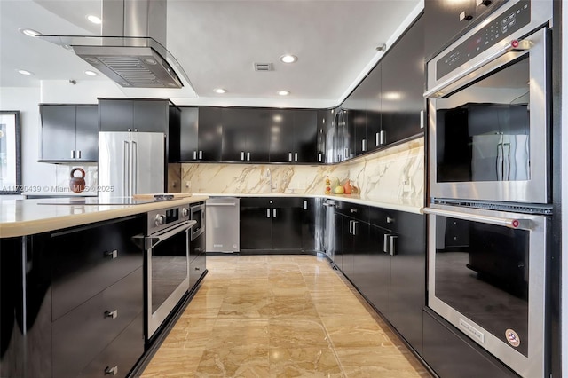 kitchen with light tile patterned floors, backsplash, and appliances with stainless steel finishes