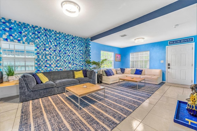 living room featuring tile patterned flooring and a healthy amount of sunlight