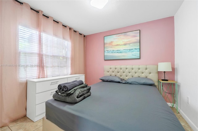 bedroom featuring light tile patterned floors