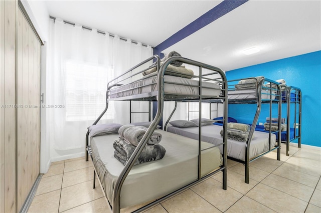 bedroom featuring light tile patterned flooring