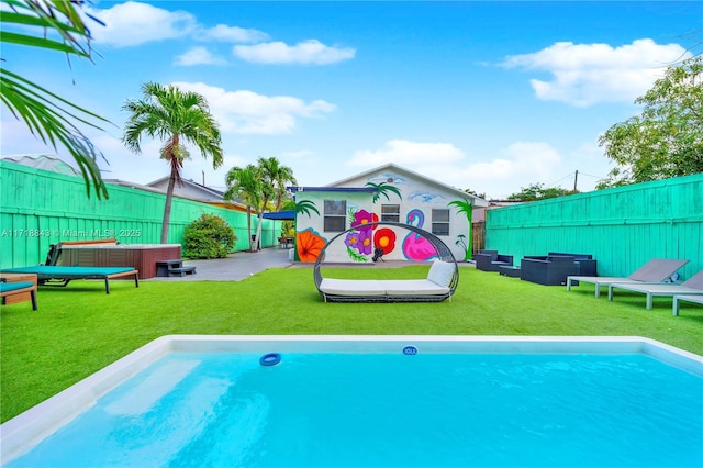 view of pool featuring a patio area and a yard