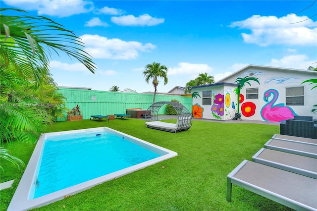 view of pool featuring a yard and central AC unit