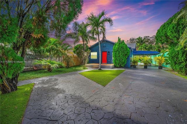 view of front of property with a yard