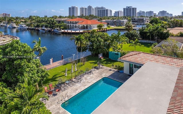 exterior space with a water view and a patio