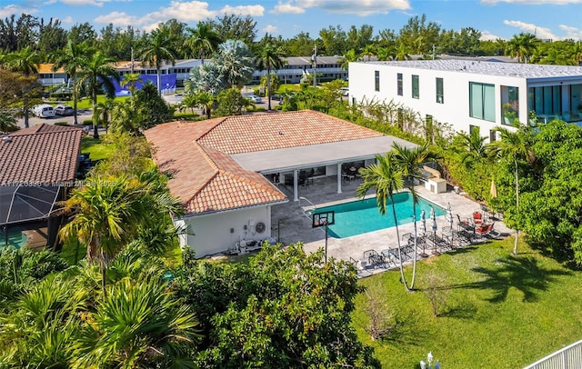 view of pool with a yard and a patio area