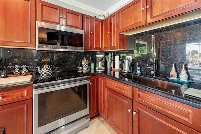 kitchen with crown molding, sink, decorative backsplash, light tile patterned floors, and appliances with stainless steel finishes