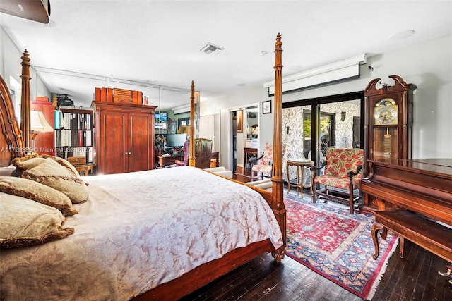 bedroom featuring hardwood / wood-style floors and french doors