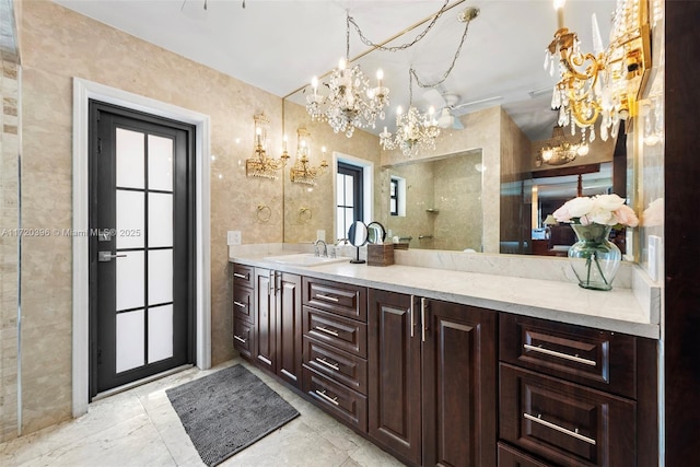 bathroom with vanity and an inviting chandelier