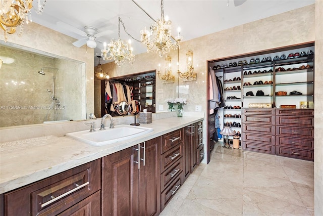 bathroom with vanity, walk in shower, and ceiling fan