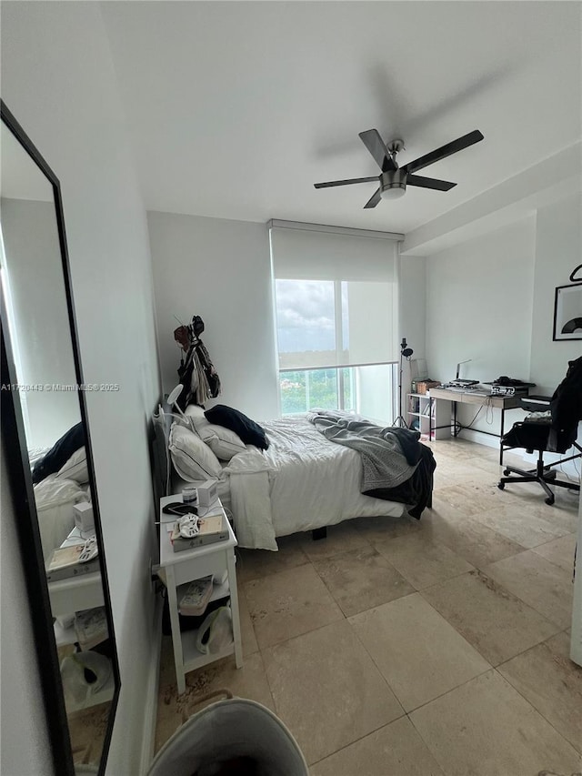 bedroom featuring ceiling fan and light tile patterned floors