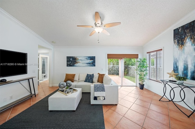 living room with ceiling fan, light tile patterned flooring, and a textured ceiling