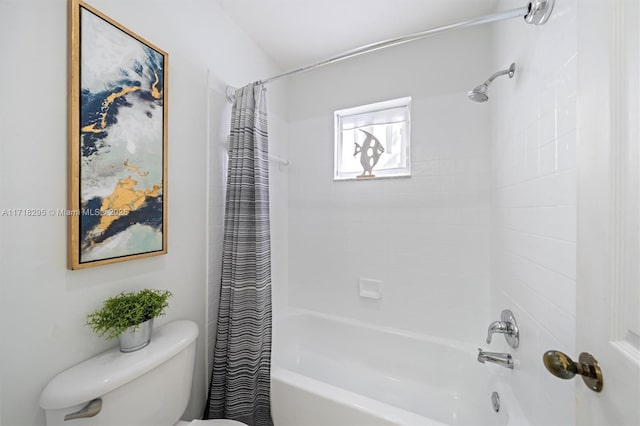 bathroom with shower / tub combo with curtain and toilet