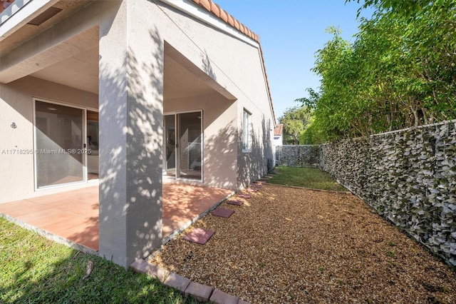 back of house featuring a patio