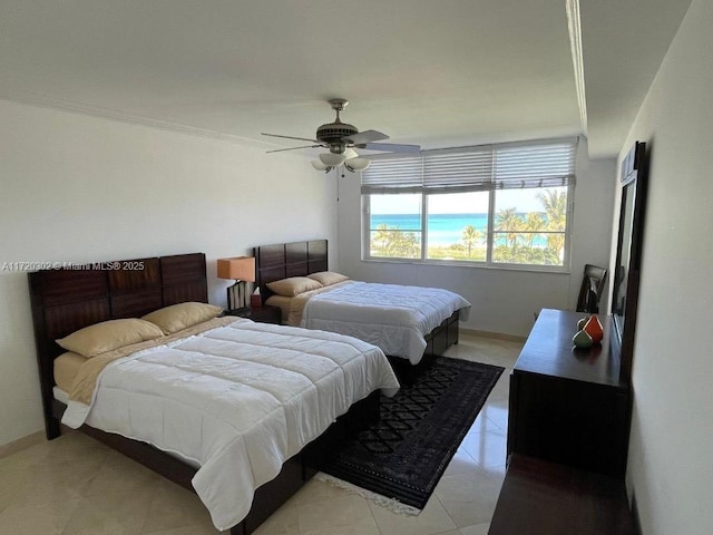 bedroom with ceiling fan and ornamental molding