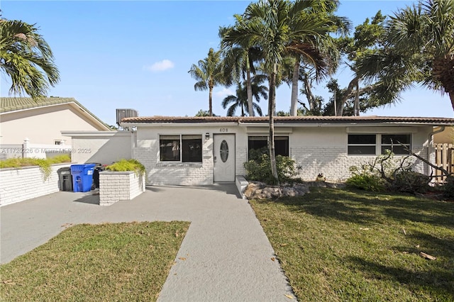 view of front of home with a front lawn