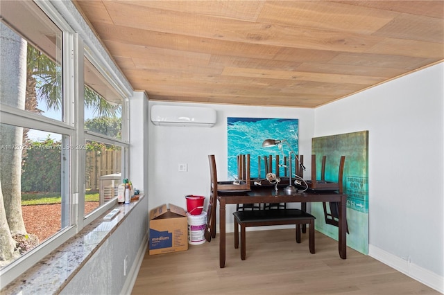 miscellaneous room featuring light hardwood / wood-style floors, an AC wall unit, plenty of natural light, and wooden ceiling