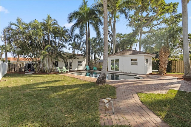 exterior space featuring a fenced in pool and a patio area